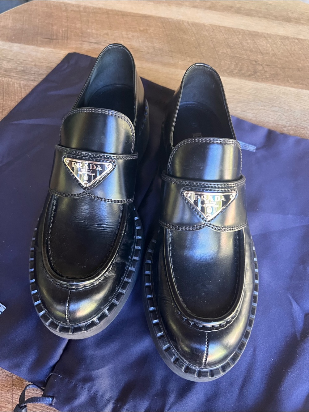 Prada Monolith Black Leather Penny Loafers with Triangle Logo